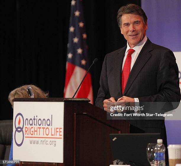 Gov. Rick Perry speaks during the general session of the 43rd annual National Right to Life Convention at the Hyatt Regency DFW International...