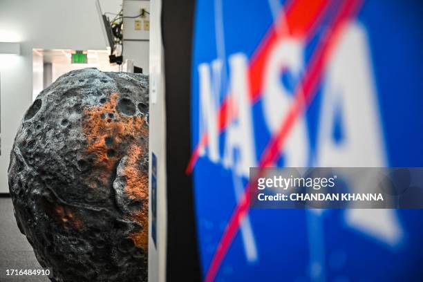 Model of the metal-rich asteroid named Psyche is displayed at the media center in NASA's Kennedy Space Center in Cape Canaveral, Florida, on October...