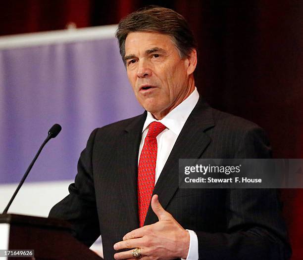 Texas Gov. Rick Perry speaks to the National Right to Life convention at the Hyatt Regency DFW International Airport Hotel June 27, 2013 in...