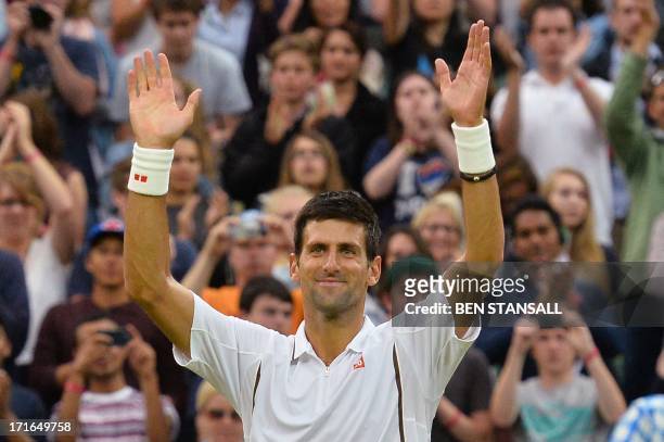 Serbia's Novak Djokovic celebrates beating US player Bobby Reynolds during their second round men's singles match on day four of the 2013 Wimbledon...