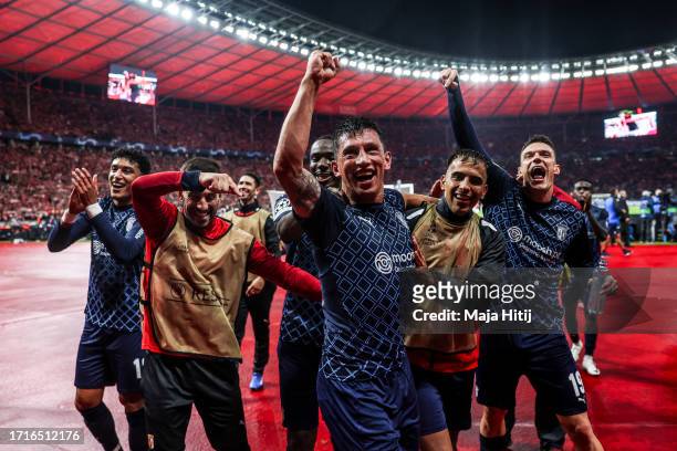 André Castro and players of of SC Braga celebrate following the team's victory during the UEFA Champions League match between 1. FC Union Berlin and...