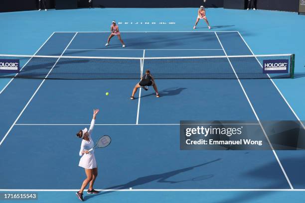 Veronika Kudermetova and Beatriz Haddad Maia of Brazil serve during the Women's double 16 round match against Nadia Kichenok of Ukraine and Monica...