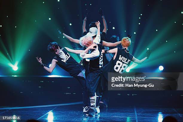 Members of boy band EXO perform onstage during the Mnet 'M CountDown' at CJ E&M Center on June 27, 2013 in Seoul, South Korea.