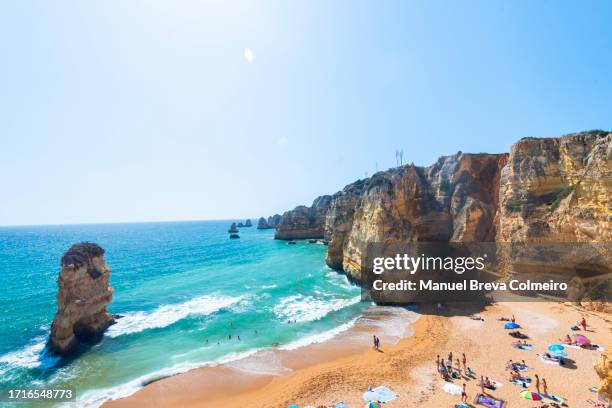 ponta piedade, algarve, portugal - praia dona ana stock-fotos und bilder