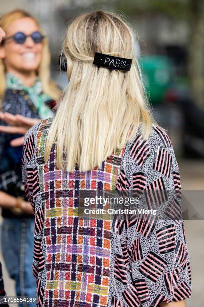 Monica Anoz wears Paris hair clip, mixed pattern jacket outside Chanel during the Womenswear Spring/Summer 2024 as part of Paris Fashion Week on...