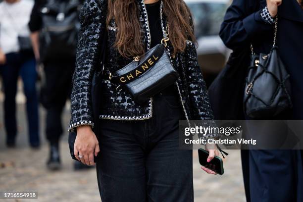 Guest wears bag outside Chanel during the Womenswear Spring/Summer 2024 as part of Paris Fashion Week on October 03, 2023 in Paris, France.