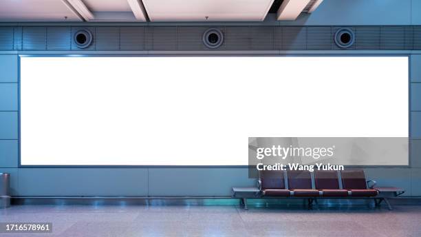 blank advertising lightbox in the waiting hall - airport billboard stock-fotos und bilder