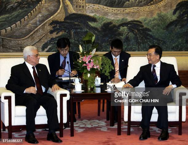 Palestinian leader Mahmud Abbas meets with Chinese Premier Wen Jiabao at the Great Hall of the People in Beijing 18 May 2005. Abbas met China's top...