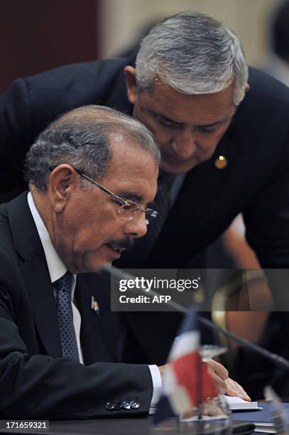 Dominican Republic President, Danilo Medina Sánchez and Guatemala's Otto Perez Molina speak during the Regular Summit of Heads of State and...