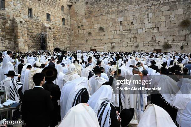 Ultra-Orthodox Jews recite the Priestly Blessings, or Birkat HaKohanim, at the Western Wall as part of the Jewish holiday of Sukkot on October 4,...