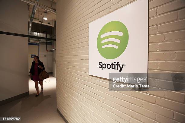 Woman walks through a hallway at Spotify offices following a press conference on June 27, 2013 in New York City. Spotify will add 130 tech and...
