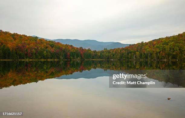 colorful autumn trees in the adirondacks - lake placid stock pictures, royalty-free photos & images