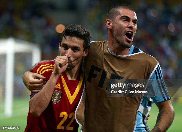 Jesus Navas of Spain celebrates scoring the winning penalty in a shootout with team-mate Victor Valdes during the FIFA Confederations Cup Brazil 2013...