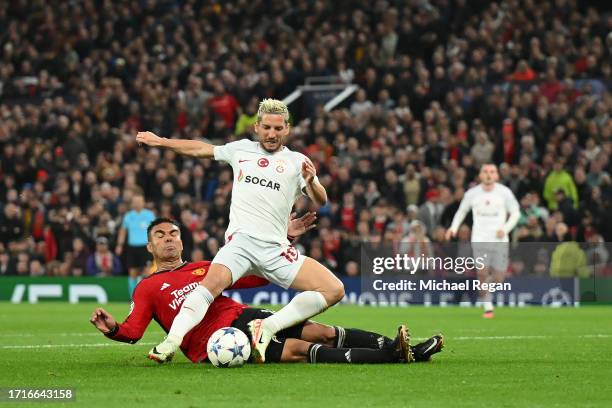 Casemiro of Manchester United fouls Dries Mertens of Galatasaray S.k to concede a penalty and receives a red card during the UEFA Champions League...