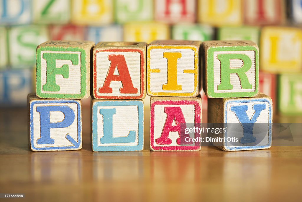 Vintage kids alphabet blocks saying FAIR PLAY