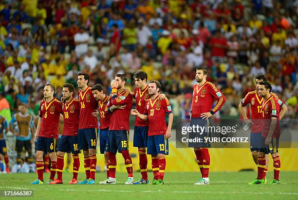 Spain's players stand together during the penalty shoot-out against Italy during their FIFA Confederations Cup Brazil 2013 semifinal football match,...