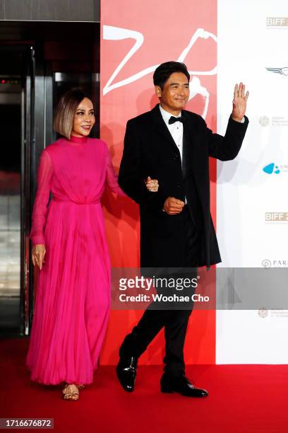 Chow Yun Fat, Jasmine Chow and Anthony Pun arrive for the Opening Ceremony of the 28th Busan International Film Festival at Busan Cinema Center on...