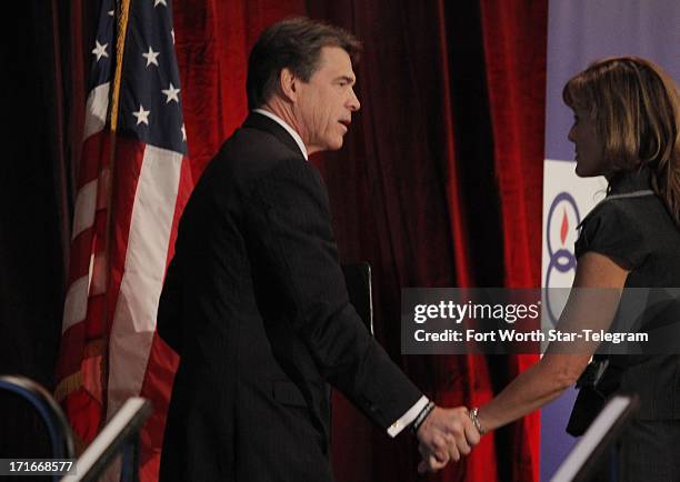 Texas Gov. Rick Perry greets Elizabeth Graham, director of the Texas Right to Life, after speaking to the general session of the 43rd annual National...