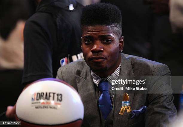 Nerlens Noel of Kentucky looks on as he sits in the draft green room during the first round of the 2013 NBA Draft at Barclays Center on June 27, 2013...