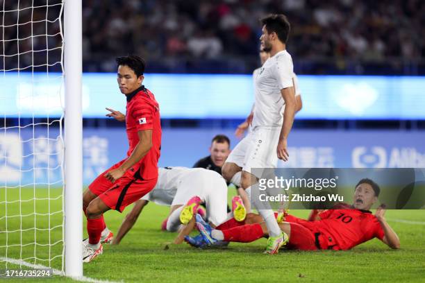 Jeong Wooyeongn of South Korea celebrates his goal with teammates during the 19th Asian Game Men's Semifinal between South Korea and Uzbekistan at...