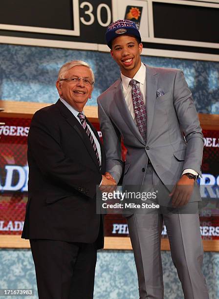Michael Carter-Williams of Syracuse poses for a photo with NBA Commissioner David Stern after Carter-Williams was drafted overall in the first round...