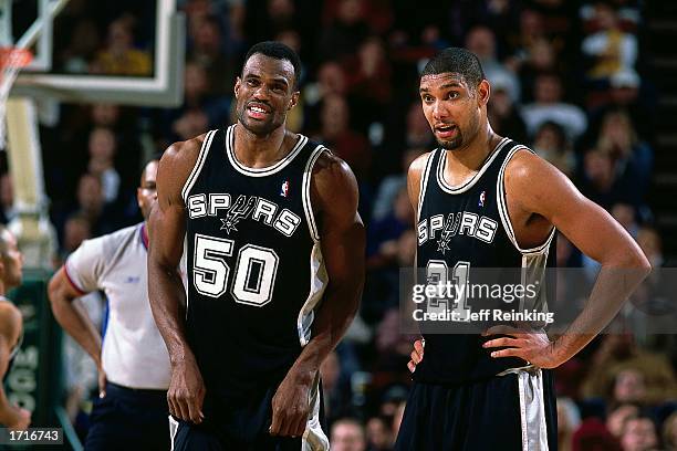 David Robinson and Tim Duncan of the San Antonio Spurs during the NBA game against the Seattle Sonics at Key Arena on December 18, 2002 in Seattle,...