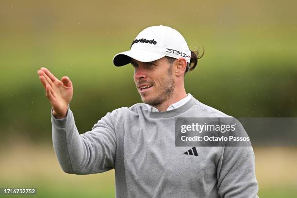 Former Footballer, Gareth Bale gestures on the third hole prior to the Alfred Dunhill Links Championship at the Old Course St. Andrews on October 04,...