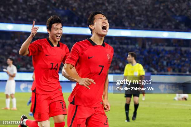 Jeong Wooyeongn of South Korea celebrates his second goal with teammates during the 19th Asian Game Men's Semifinal between South Korea and...