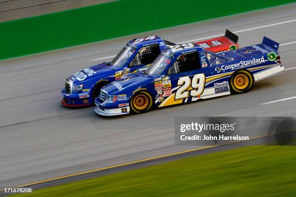 Ryan Blaney, driver of the Cooper Standard Ford, and Darrell Wallace Jr., driver of the Camping World/Good Sam Toyota, race during the NASCAR Camping...