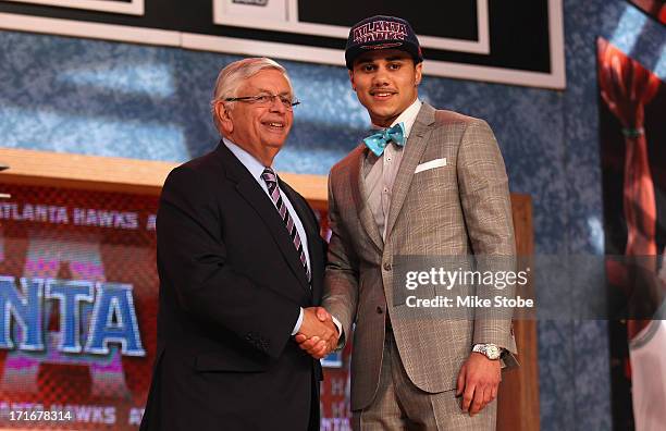 Shane Larkin of Miami poses for a photo with NBA Commissioner David Stern after Larkin was drafted overall in the first round by the Atlanta Hawks...