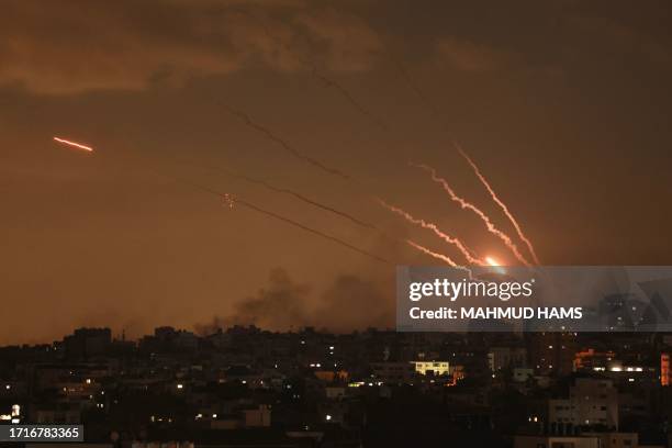 Salvo of rockets is fired by Palestinian militants from Gaza towards Israel on October 10, 2023. Israel said it recaptured Gaza border areas from...