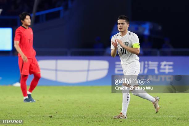 Jasurbek Jaloliddinov of Uzbekistan celebrates his goal during the 19th Asian Game Men's Semifinal between South Korea and Uzbekistan at Huanglong...