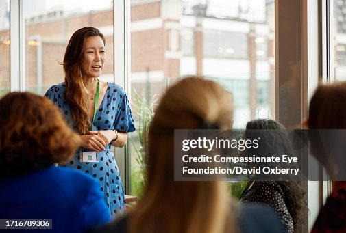 Asian businesswoman giving speech at women's networking event