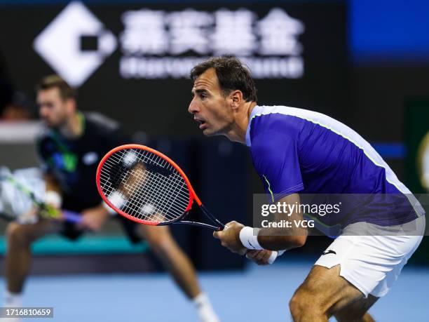 Austin Krajicek of the United States and Ivan Dodig of Croatia compete in the Men's Doubles Final match against Wesley Koolhof of Netherlands and...