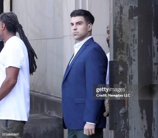 Sotirios Spanos of Syosset, New York, is led out of the Nassau County Courthouse in Mineola, New York after being charged with aggravated vehicular...