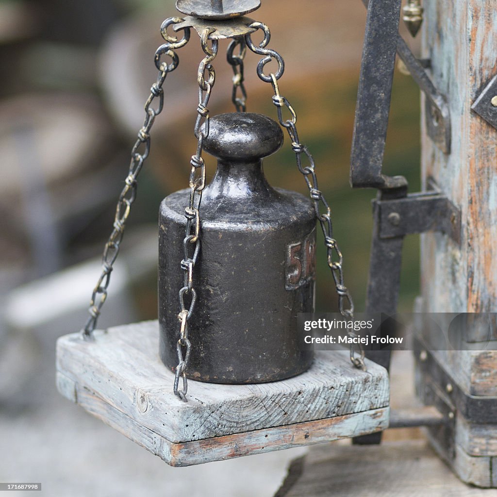 Old balance with lead weight