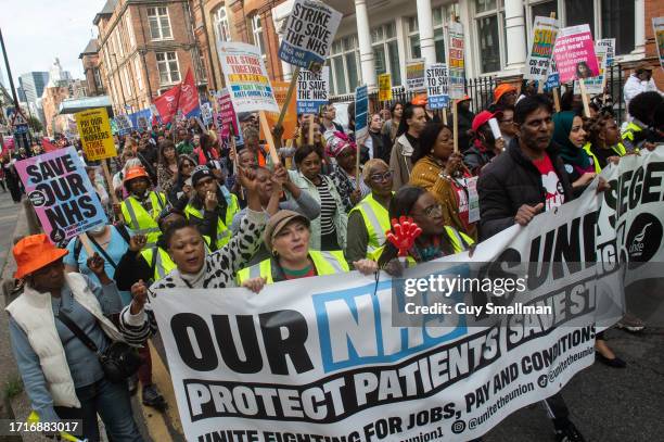 Striking members of the BMA and UNIT trade unions march around Royal London Hospital on October 4, 2023 in London, England. Junior Doctors and...