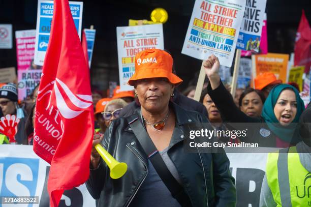 Striking members of the BMA and UNIT trade unions march around Royal London Hospital on October 4, 2023 in London, England. Junior Doctors and...