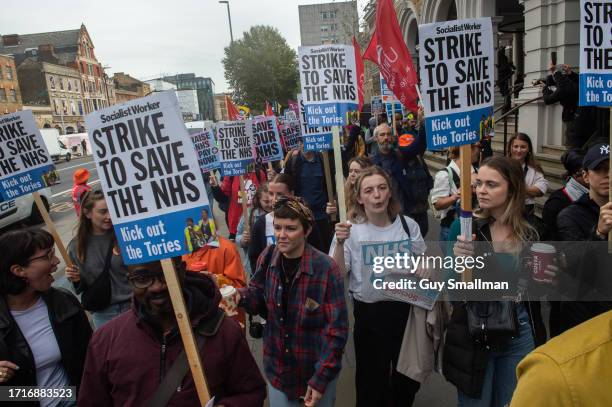 Striking members of the BMA and UNIT trade unions march around Royal London Hospital on October 4, 2023 in London, England. Junior Doctors and...
