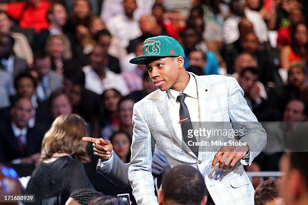 Giannis Antetokounmpo of Greece qals towards the stage after he was drafted overall in the first round by the Milwaukee Bucks during the 2013 NBA...