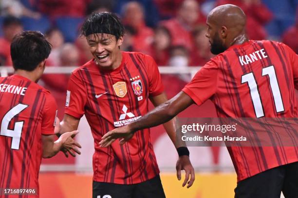 Toshiki Takahashi of Urawa Red Diamonds celebrates scoring his side's third goal with his teammates during the AFC Champions League Group J match...