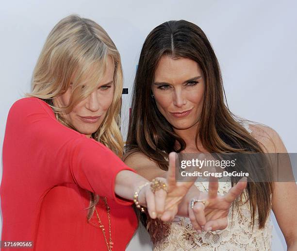 Actors Daryl Hannah and Brooke Shields arrive at the Los Angeles premiere of "The Hot Flashes" at ArcLight Cinemas on June 27, 2013 in Hollywood,...