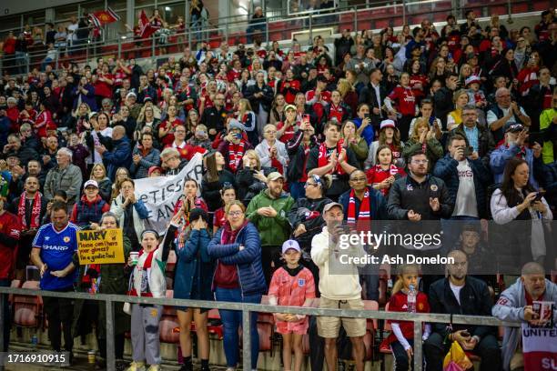 Manchester United fans look on prior to the UEFA Women's Champions League Qualifying Second Round match between Manchester United Women and Paris...
