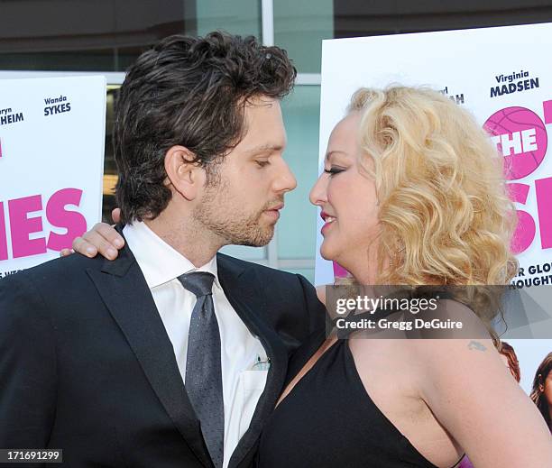 Actors Virginia Madsen and Nick Holmes arrive at the Los Angeles premiere of "The Hot Flashes" at ArcLight Cinemas on June 27, 2013 in Hollywood,...