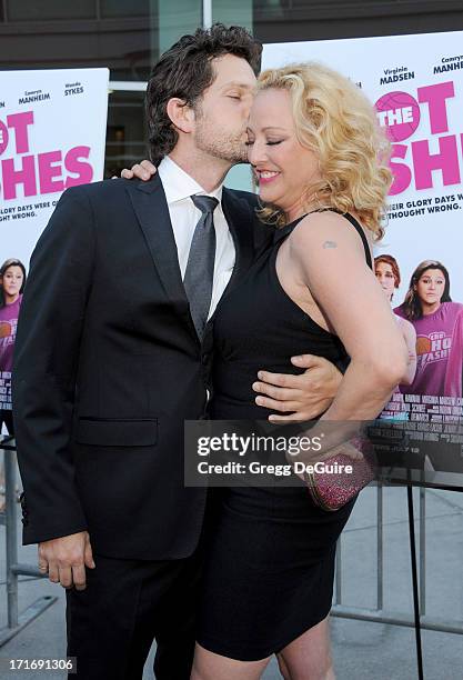 Actors Virginia Madsen and Nick Holmes arrive at the Los Angeles premiere of "The Hot Flashes" at ArcLight Cinemas on June 27, 2013 in Hollywood,...