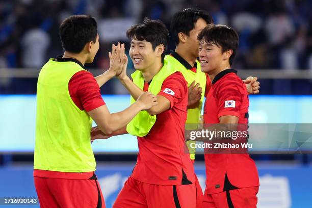 Lee Kangin of South Korea celebrates the victory during the 19th Asian Game Men's Semifinal between South Korea and Uzbekistan at Huanglong Sports...