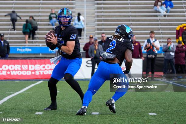 Buffalo Bulls Quarterback Cole Snyder looks to throw the ball during the first half of the College Football game between the Central Michigan...