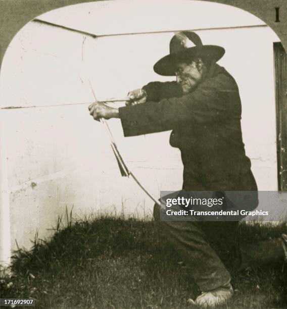 Underwood & Underwood publishes stereo views for education like this example of Geronimo with a bow and arrow from 1900 out of New York City.