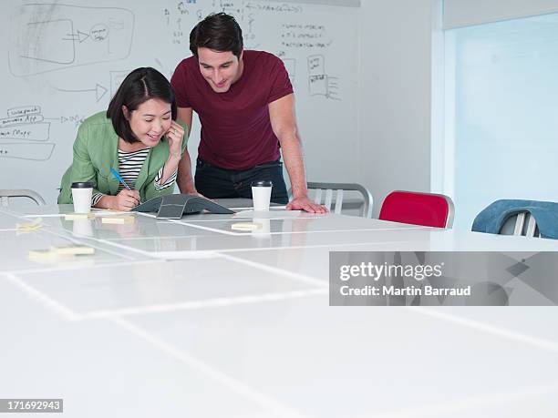 business people teleconferencing in conference room - conference phone stock pictures, royalty-free photos & images