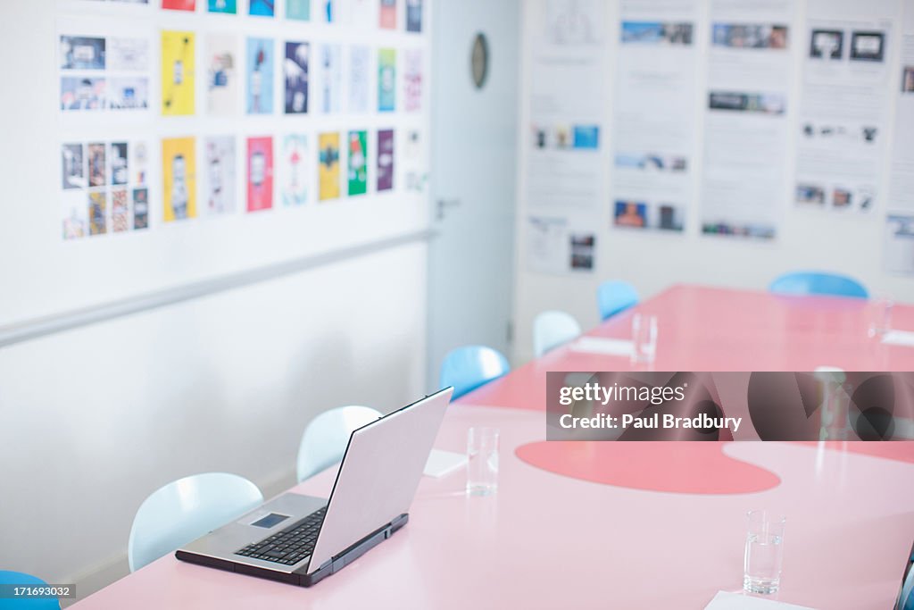 Laptop on table in conference room